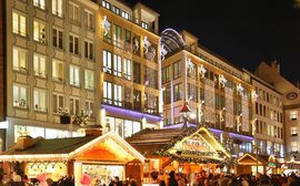 Christmas market illuminated at night in the pedestrian zone in Munich's old town.