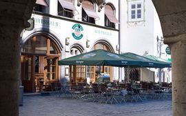 Terrace of the Wirtshaus Ayinger am Platzl with sunshades.