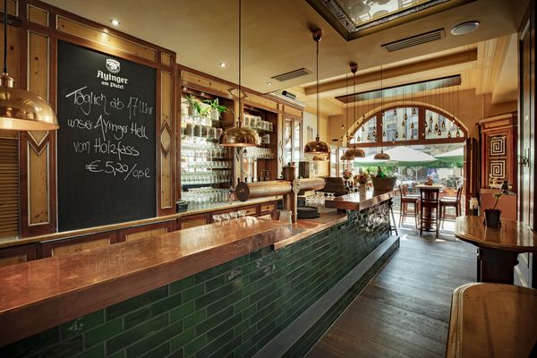 Green bar counter at Ayingers at the Platzl Hotel.